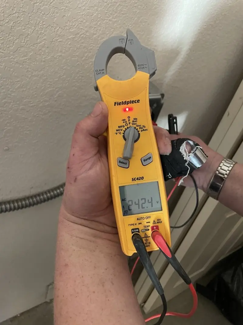 Voltage testing with clamp meter during Circuit Breaker Repair in Calera